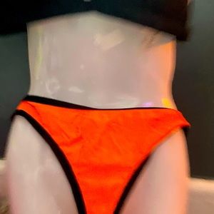 Fluorescent orange and black bikini size medium